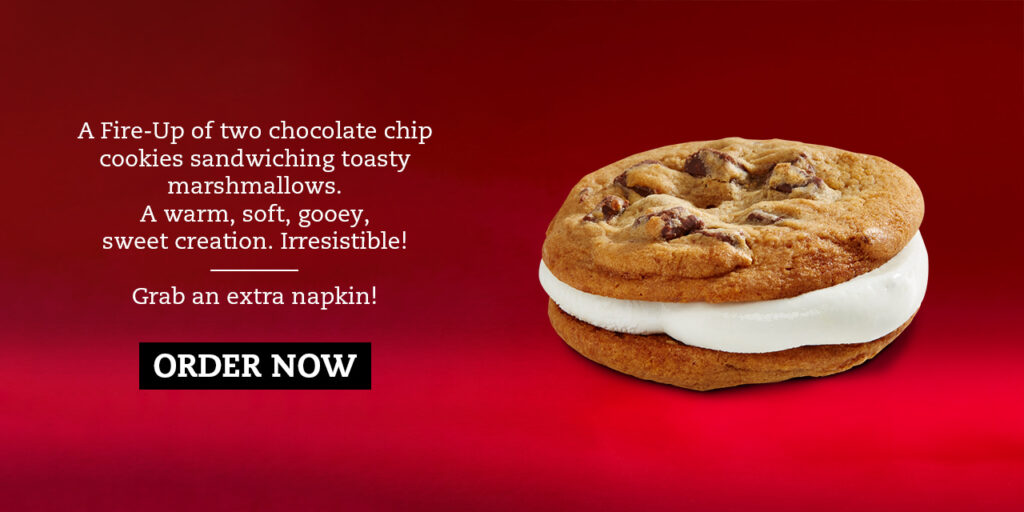 A Fire-Up of two chocolate chip cookies sandwiching toasty marshmallows. A warm, soft, gooey, sweet creation. Irresistible! — Grab an extra napkin!